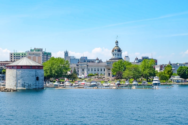 downtown kingston ontario buildings and boats at historic waterfront.